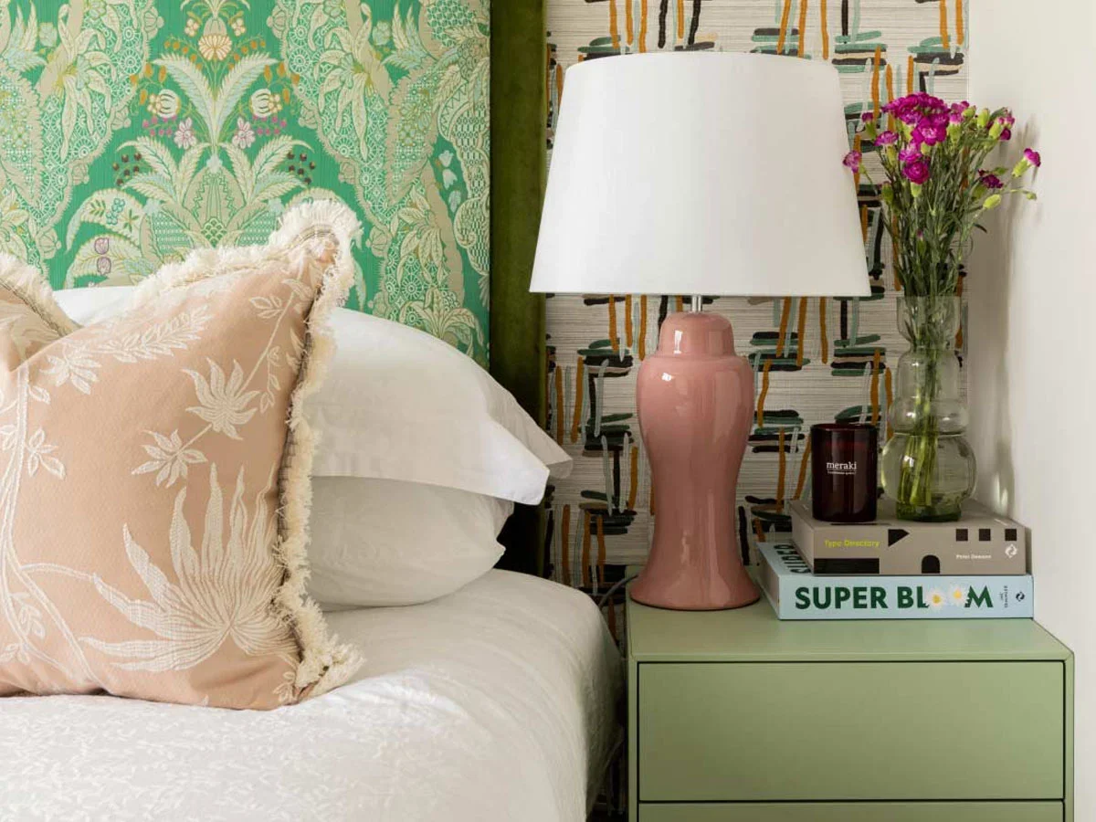 green-patterned-headboard-pink-bedside-lamp-eclectic-bedroom