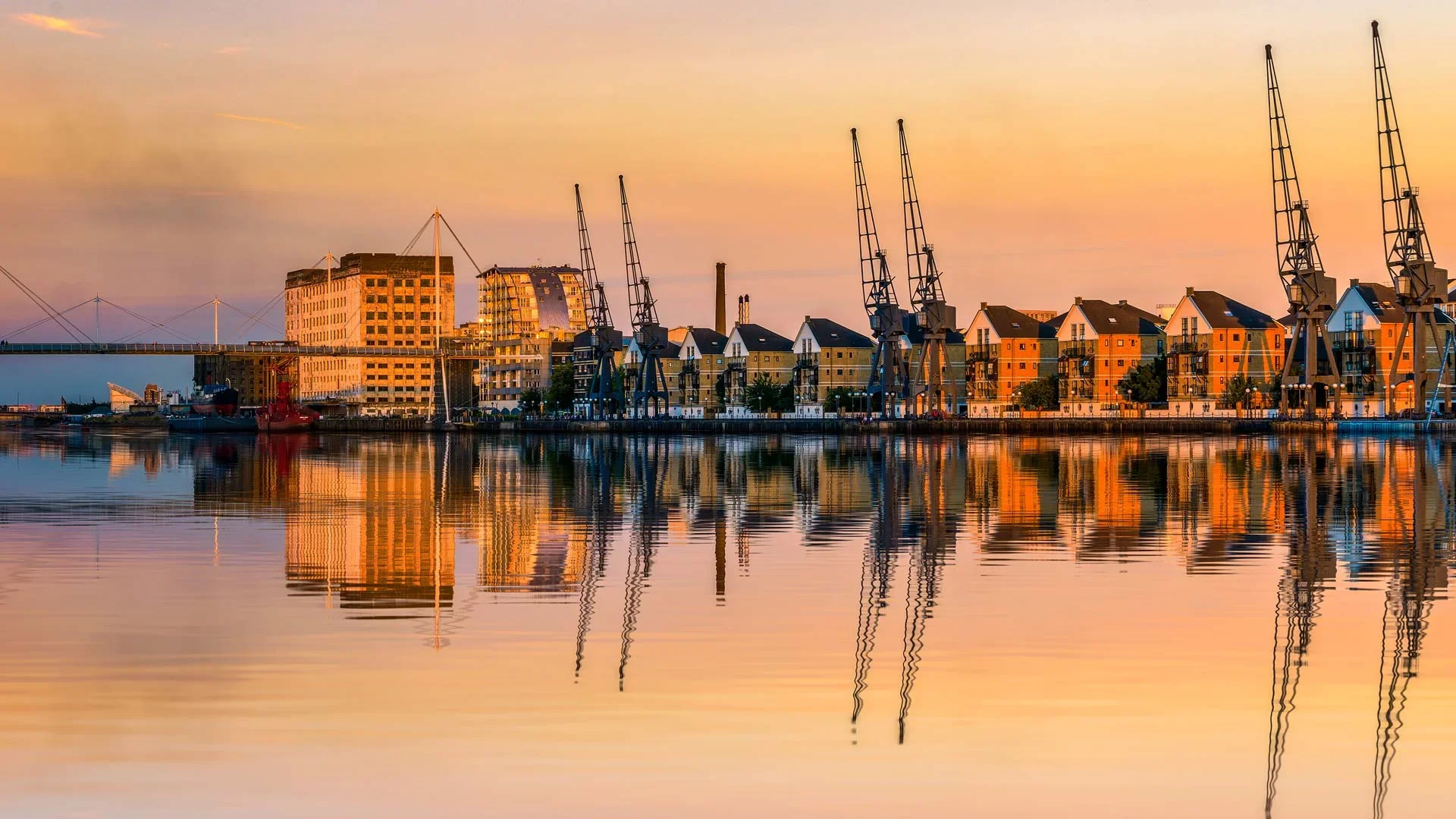 london-royal-docks-with-historic-cranes-at-sunset