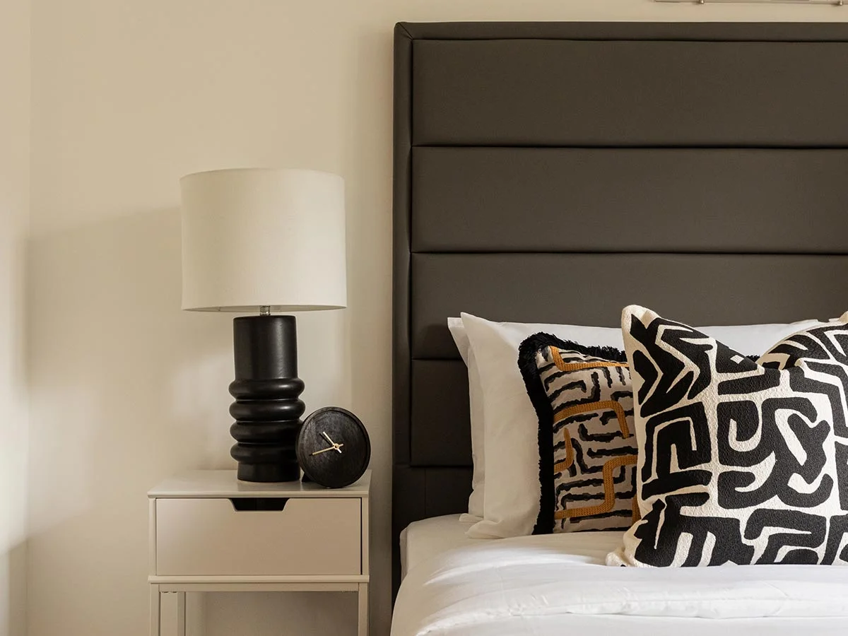 boutique-bedroom-bedside-styling-with-black-ribbed-lamp-clapham