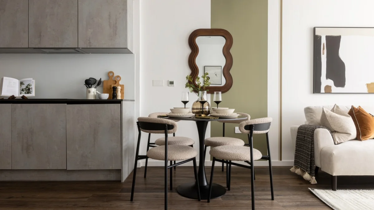 Modern Airbnb apartment with a compact dining area, contemporary kitchen and neutral furnishings suited to short-term rental guests.