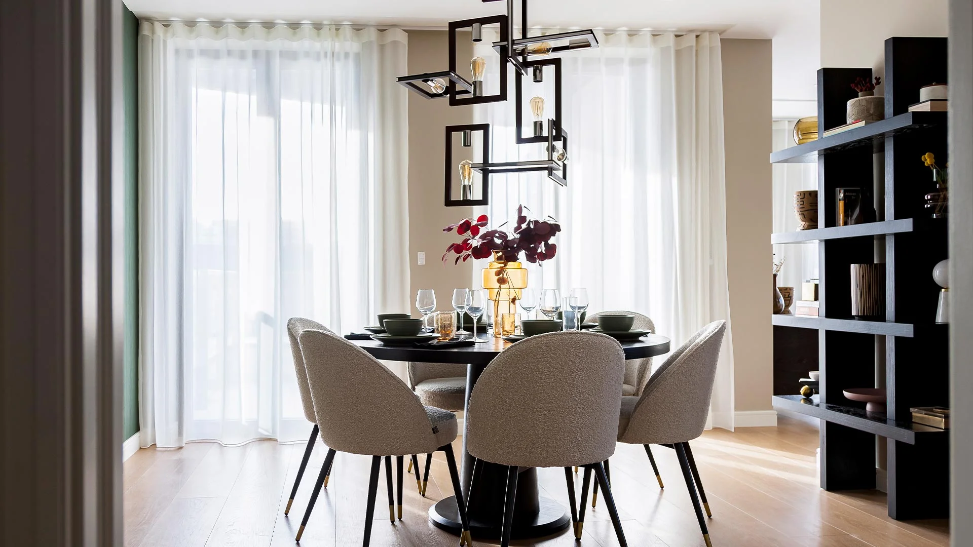 Custom fitted curtains in dining area with soft natural light filtering fabric