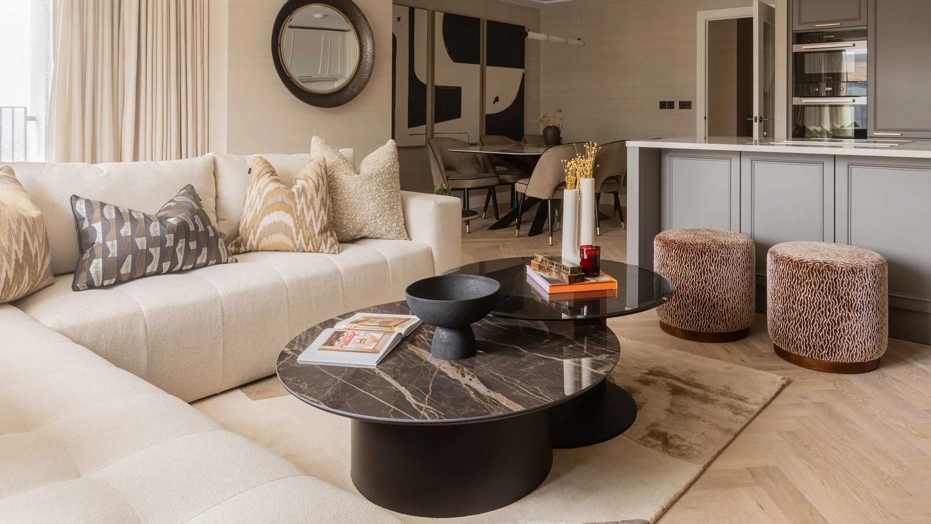Elegant open-plan living room professionally furnished with bespoke furniture, styling and interior design services for London homes.