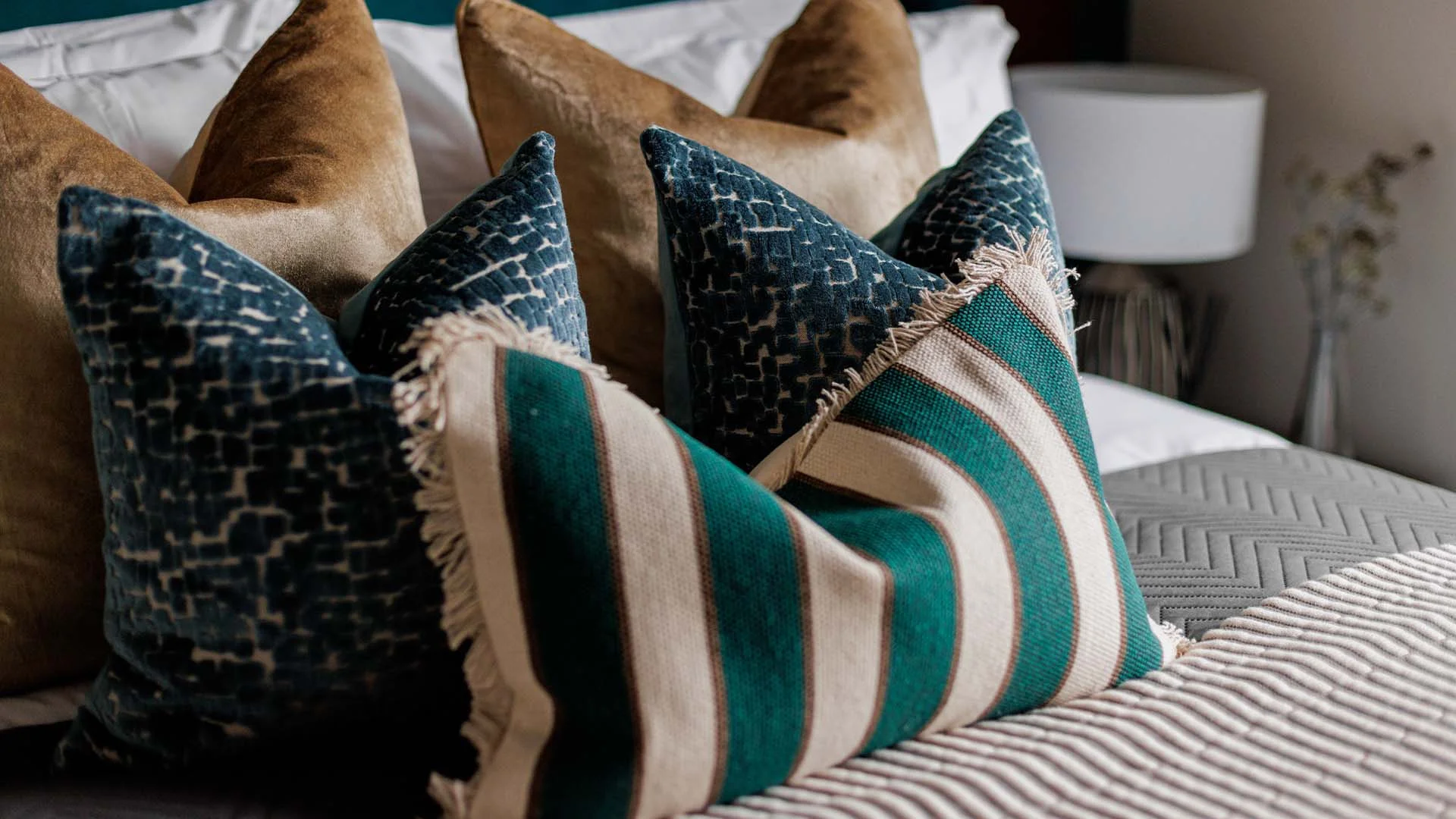Stylish bedroom cushions and soft furnishings from gold furniture package interior design