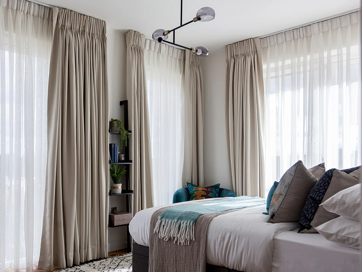 Luxury floor to ceiling bedroom curtains with elegant layered window treatment