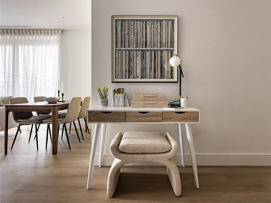 Minimal home office setup with upholstered chair and wooden desk in contemporary Regents View apartment
