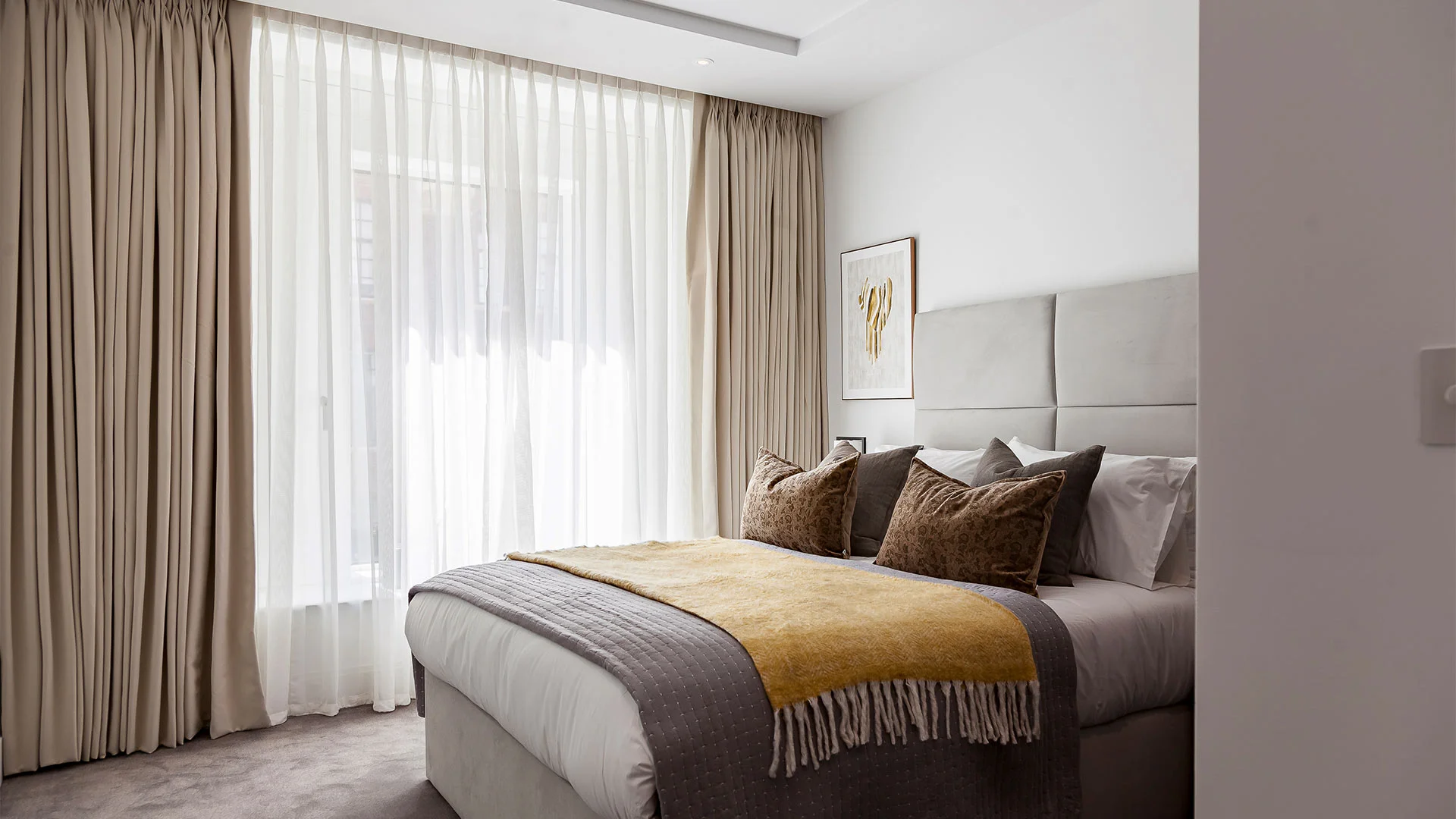 Tailored bedroom curtains with neutral tones and premium fabric finish